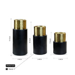 A BLACK AND GOLD METAL MULTIPURPOSE CANDLE HOLDER