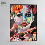 Abstract Painting of woman's face adorned with vibrant flowers